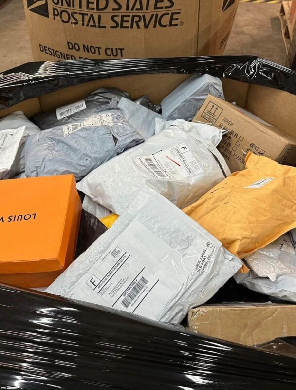 Unclaimed mail pallets in Louisiana with mixed wholesale merchandise boxes